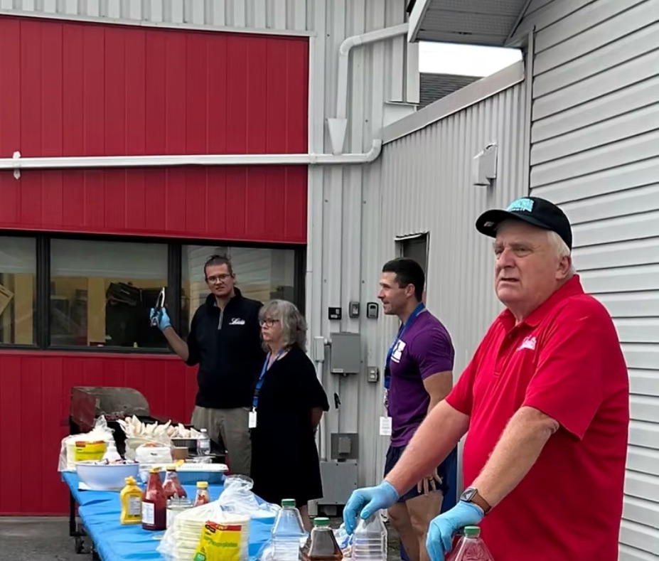 Paul volunteering at a community barbecue event